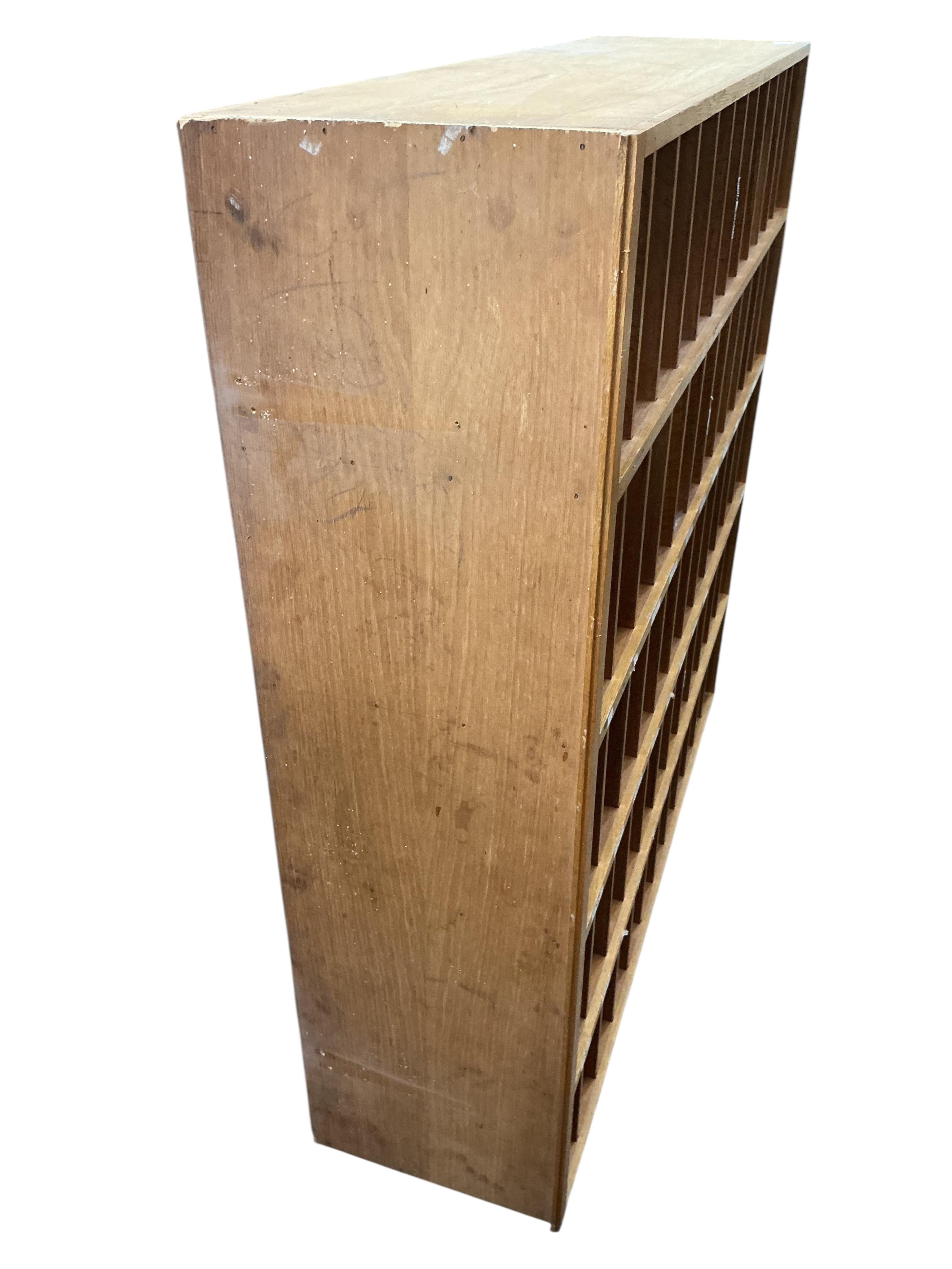 A mid century oak pigeonhole unit, width 122cm, depth 33cm, height 124cm